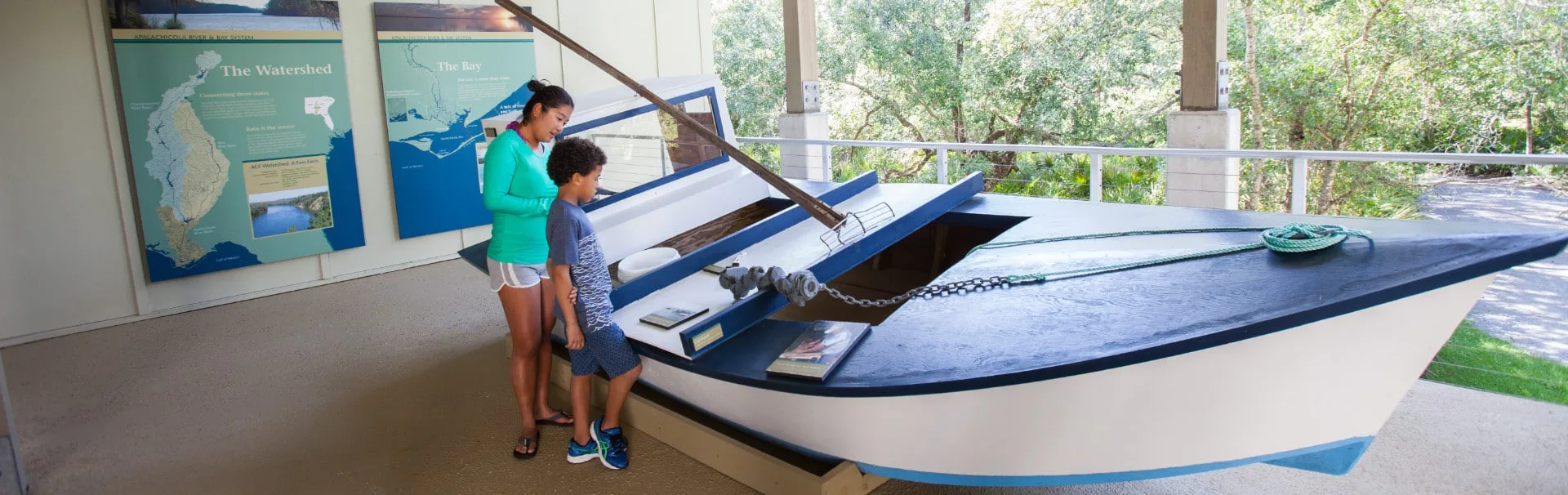 Teacher and student checking out the oyster boat