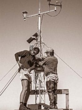 Research Coordinator Lee Edmiston and future Research Coordinator Jenna Harper maintain the meteorology station located in East Bay marsh. Each eventually went on to manage the Reserve.