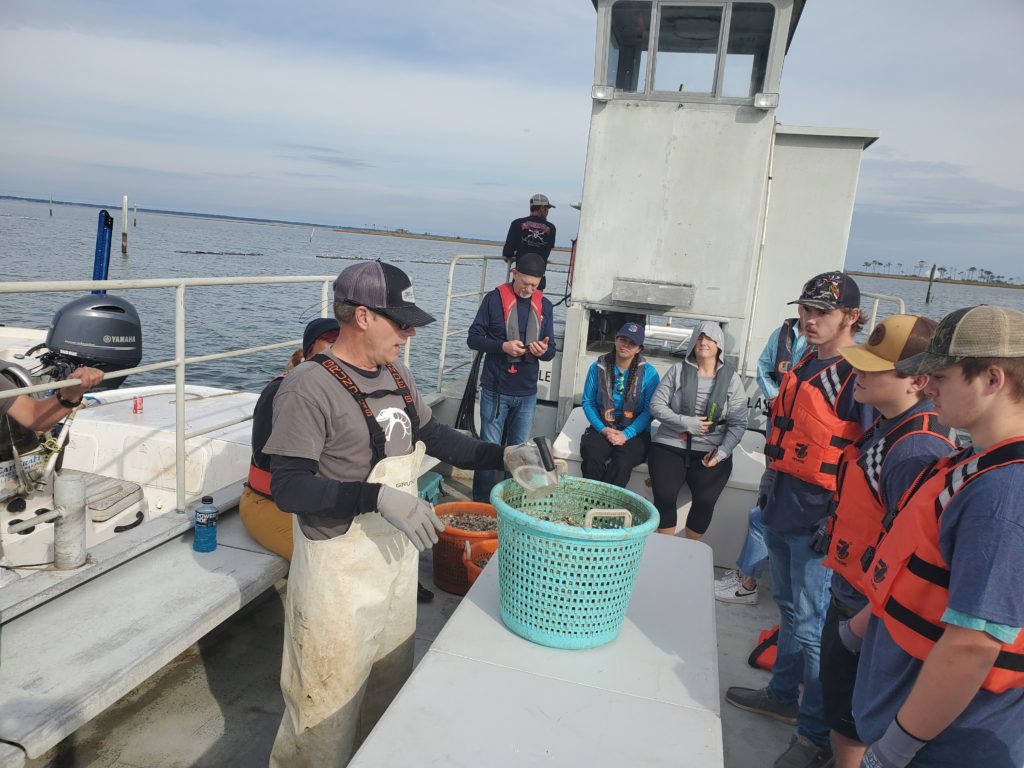 Todd Brackin Teach Corps Students how to fill oyster cages dec 7, 2021