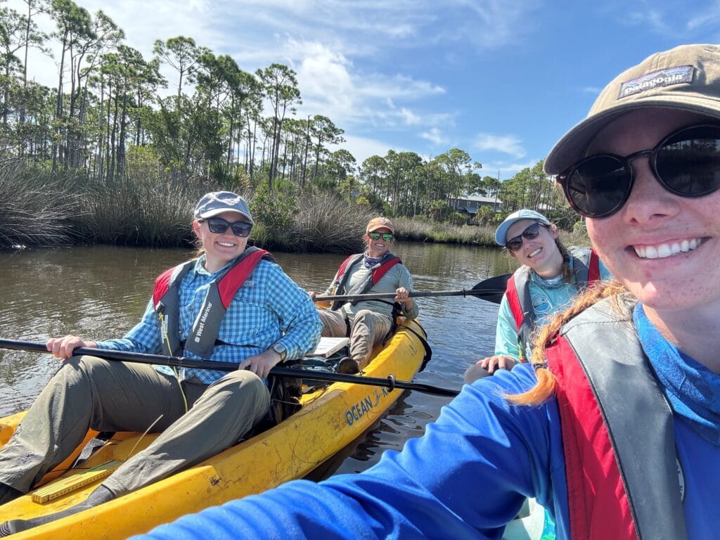 Stewardship team kayaking to the mangrove transect sites.