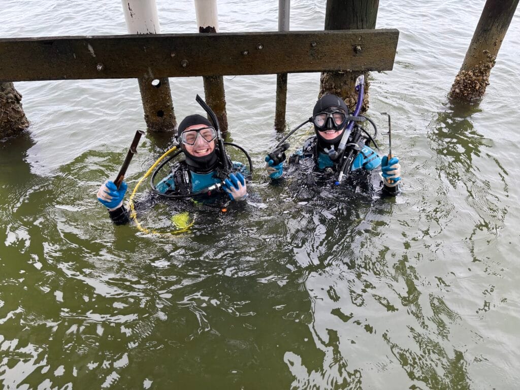 The Reserve Research staff Sam and Michael preparing to clean a water quality station.